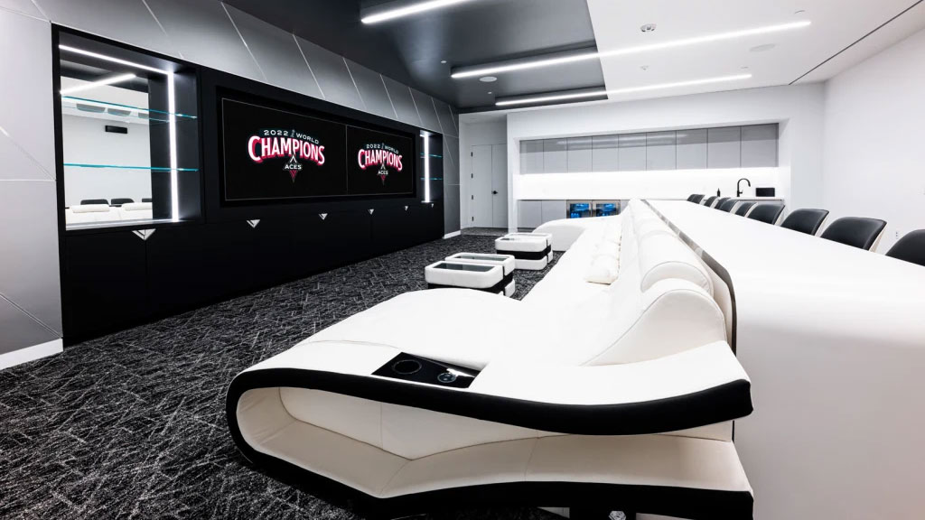 A room with a large bed and a tv.