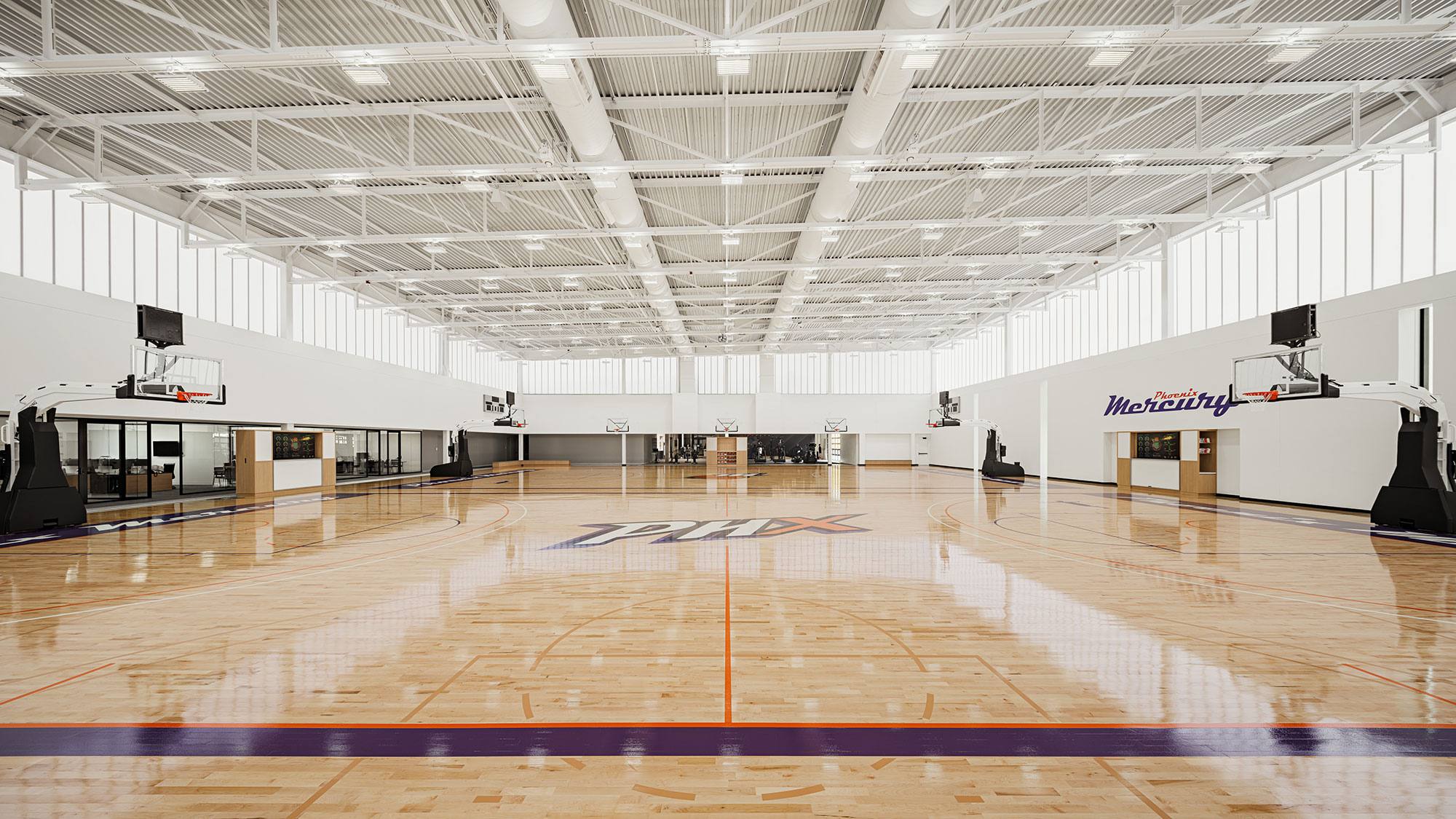 A basketball court with a basketball hoop.