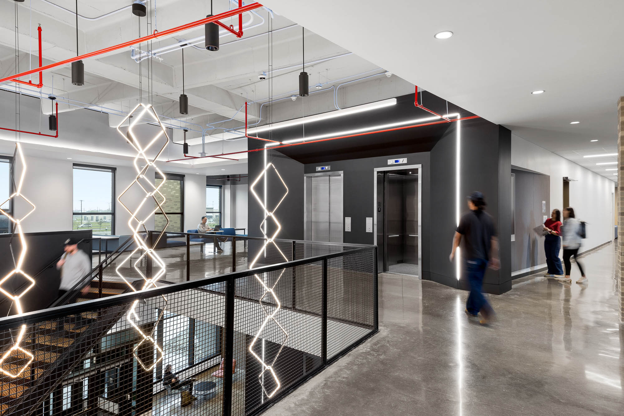 A group of people walking in a building.