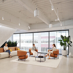 A few people sitting in a room.