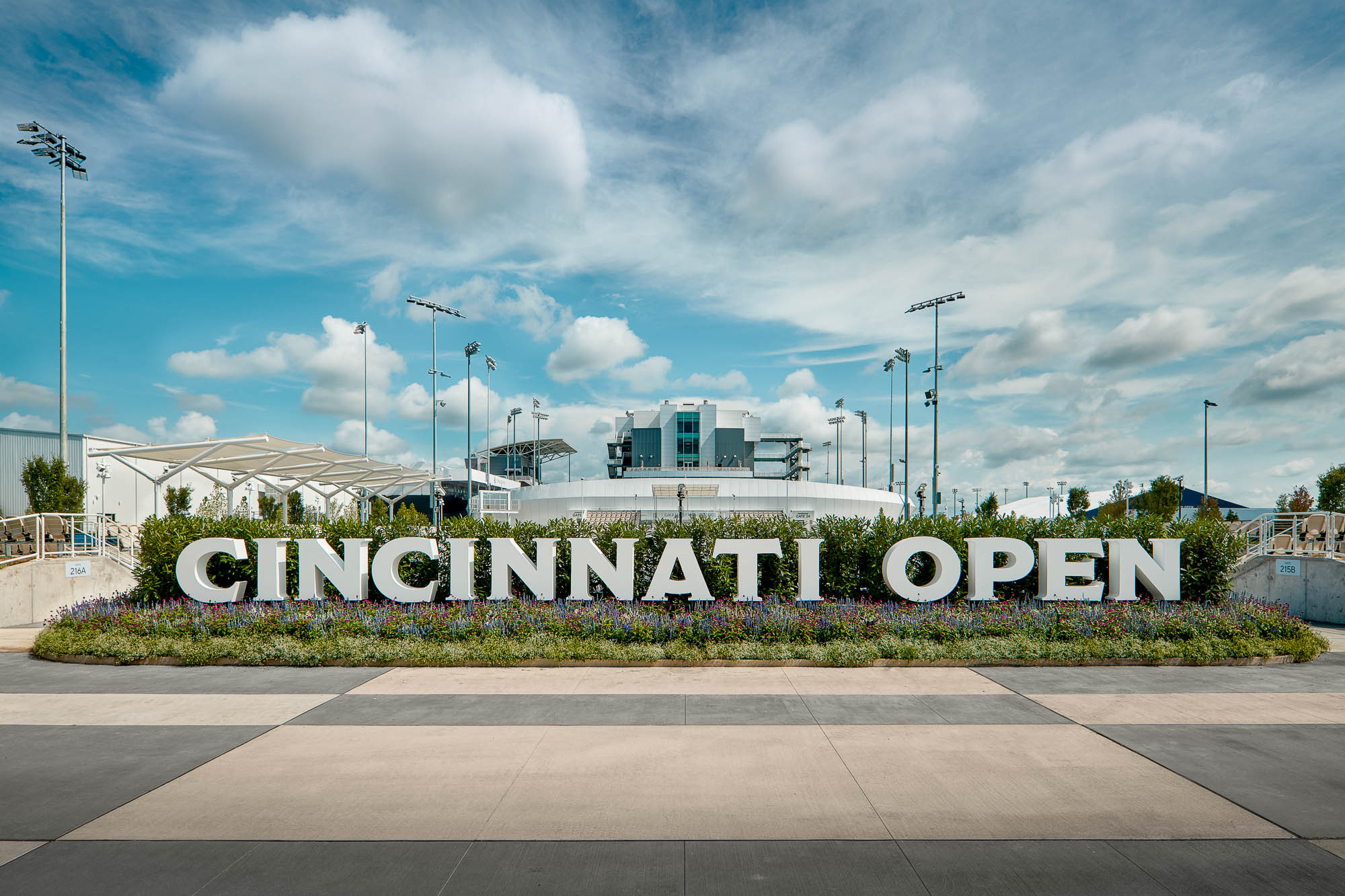 A sign with a building in the background.