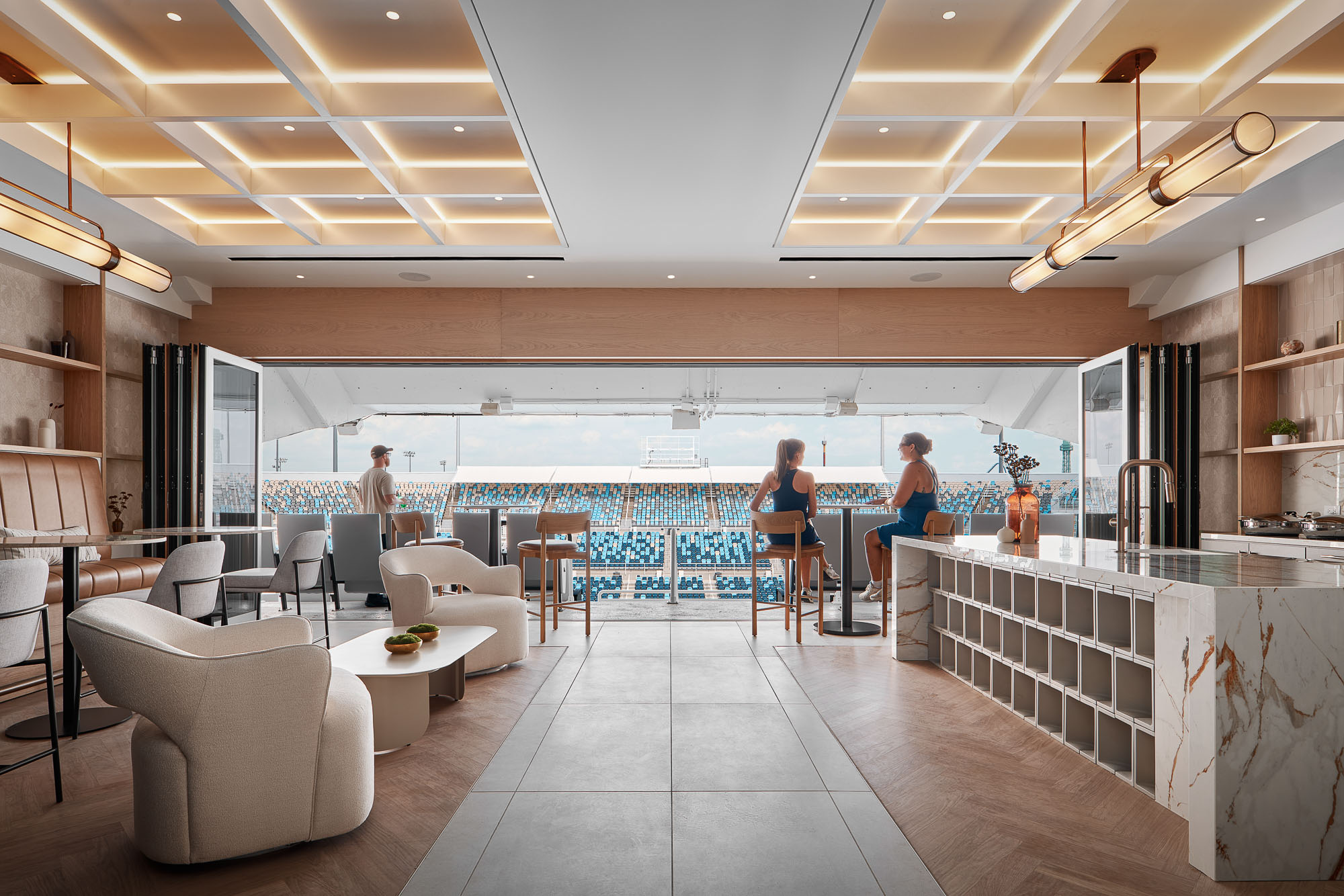 A room with a bar and chairs.