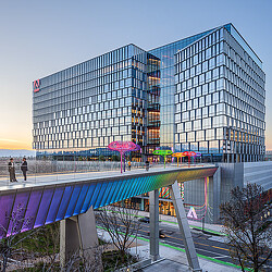 Adobe Founders Tower exterior with pedestrian bridge