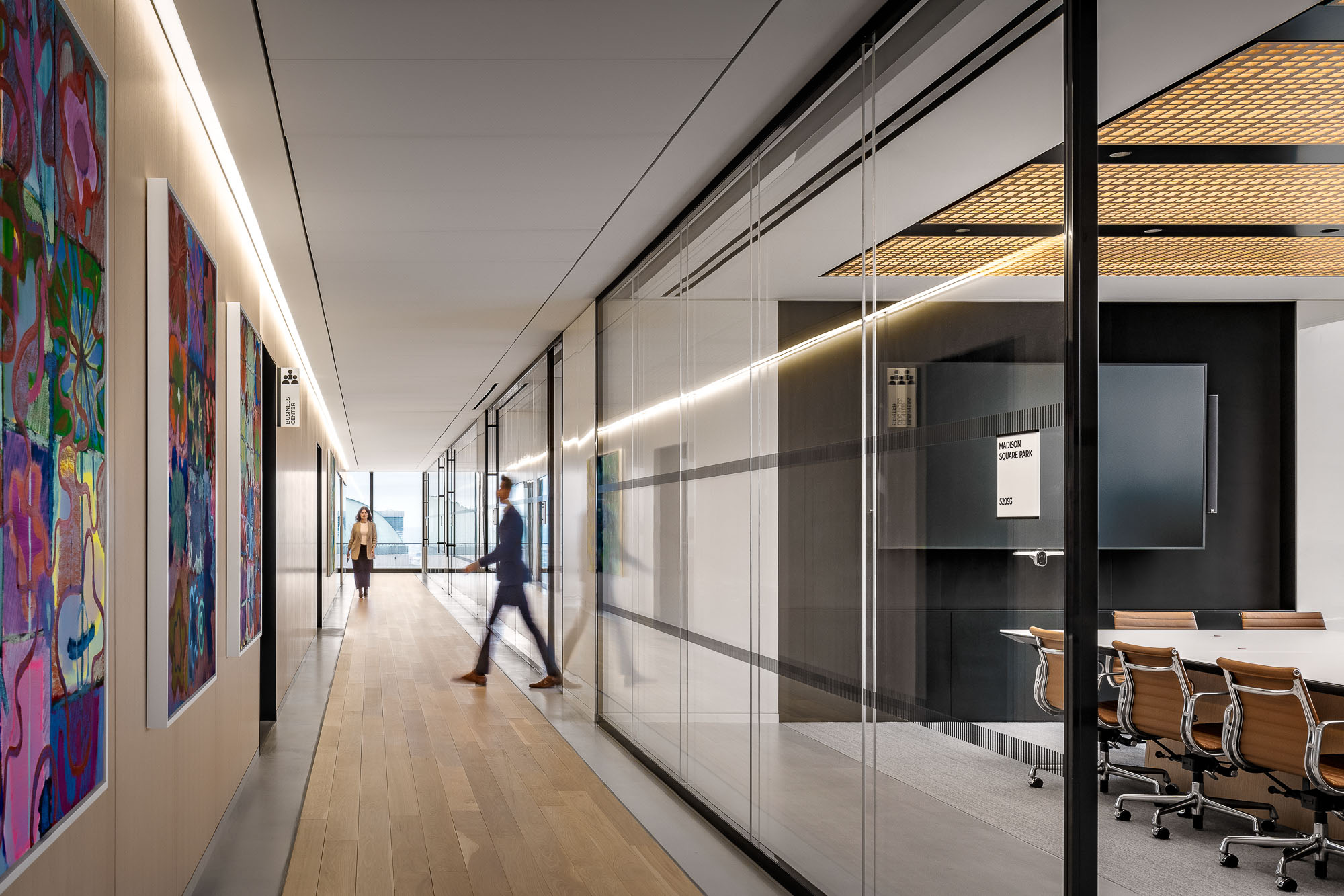 A long hallway with people walking.