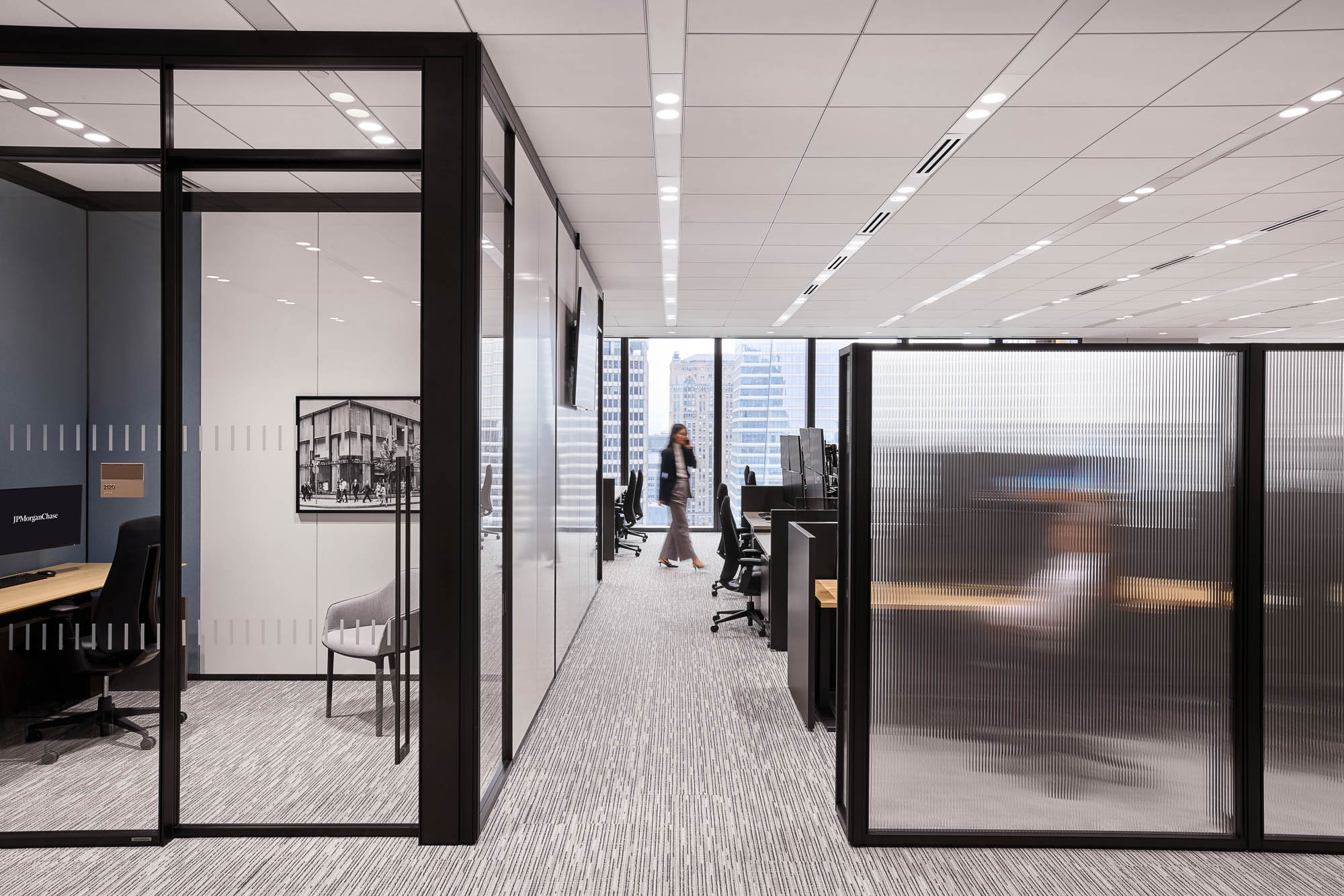 A person walking through an office.