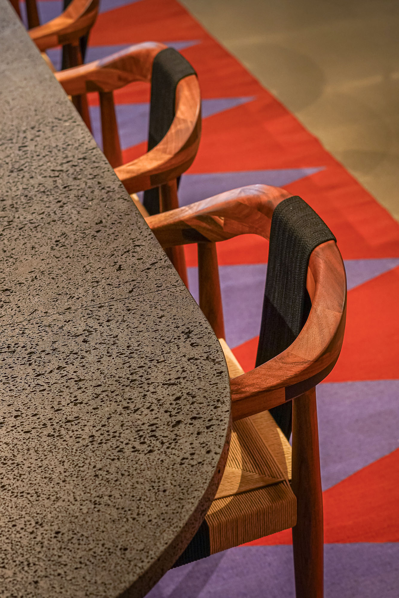 A person's foot on a chair.