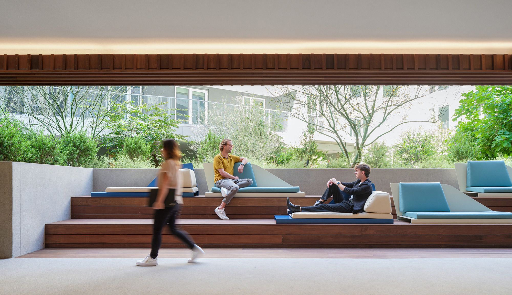 A group of people sitting on a bench.