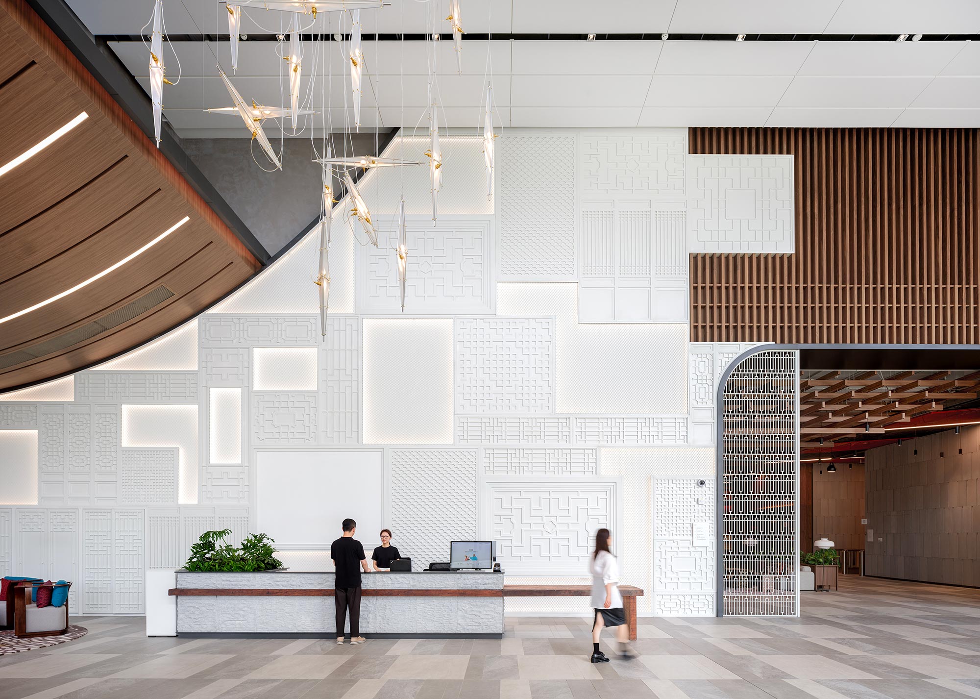 A few people in a large room.