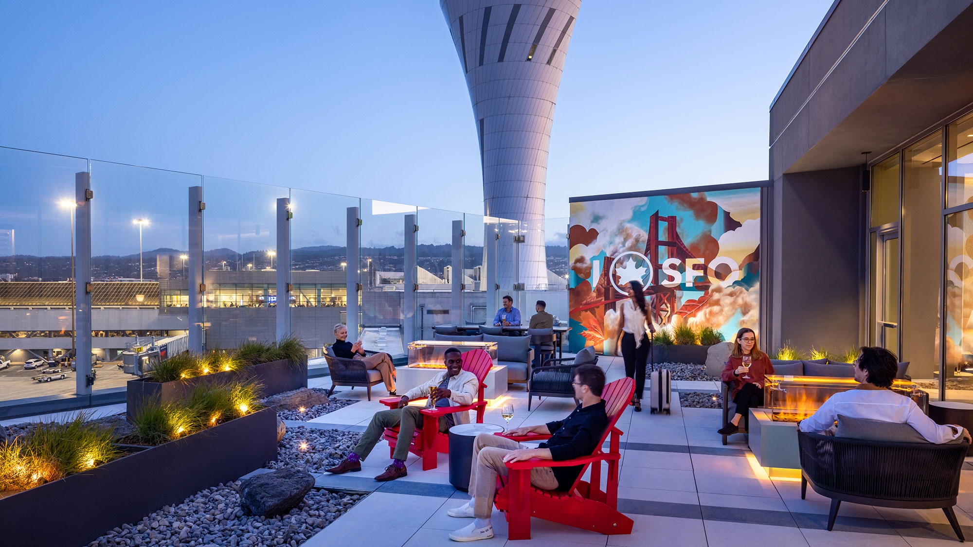 A group of people sitting outside.