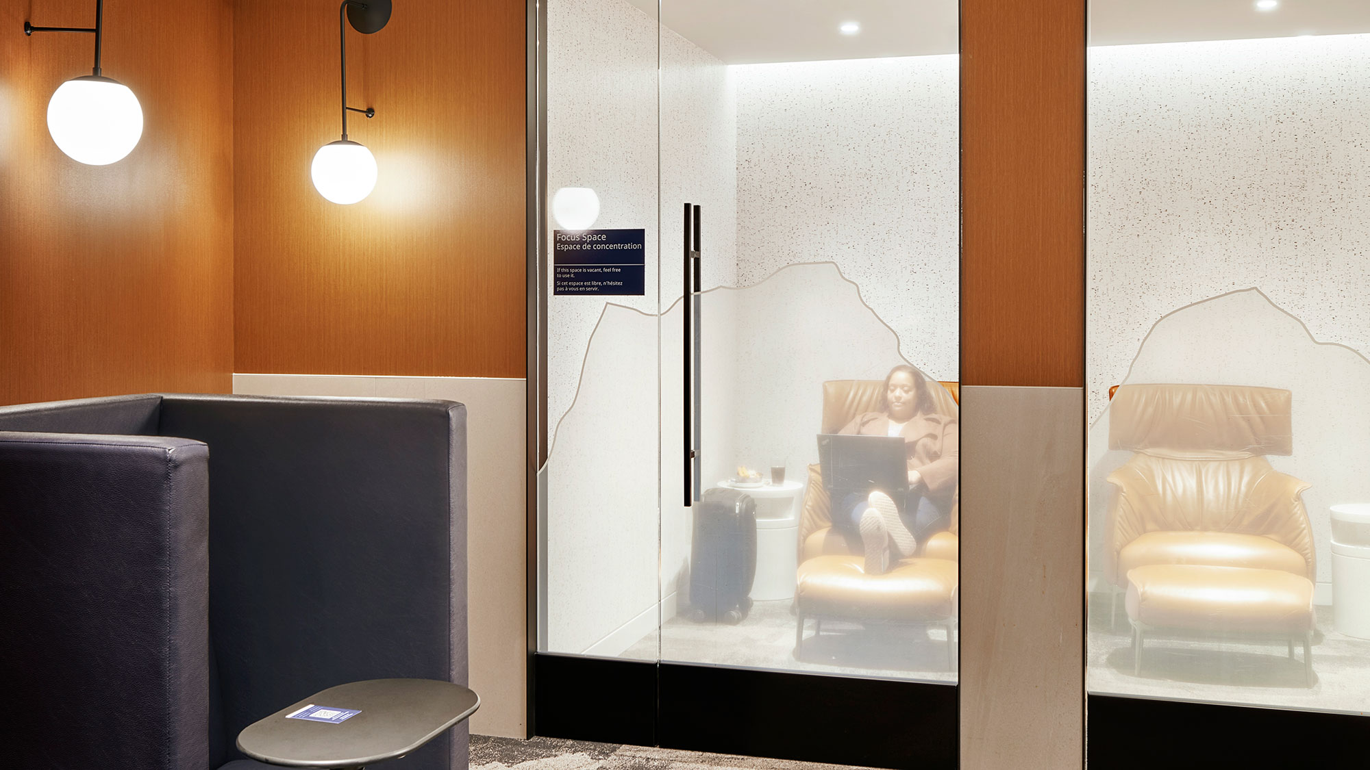 A bathroom with a large mirror.