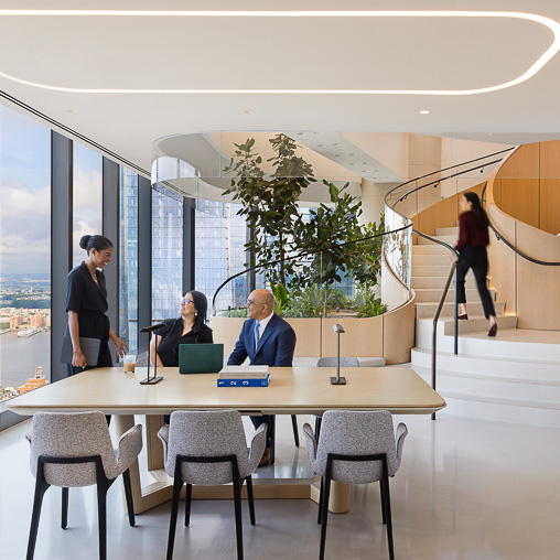 A group of people in a conference room.