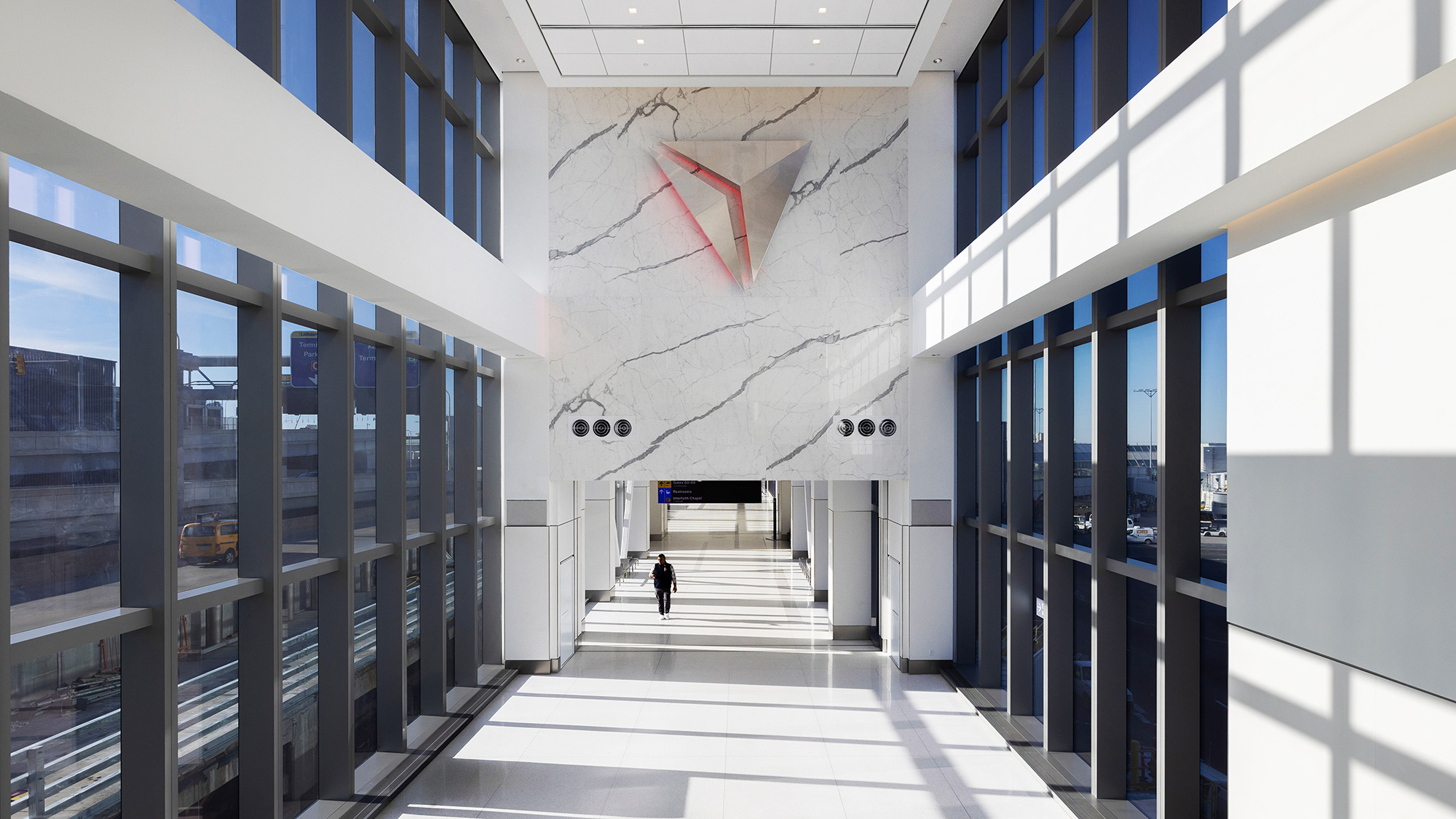 A person walking in a hallway.