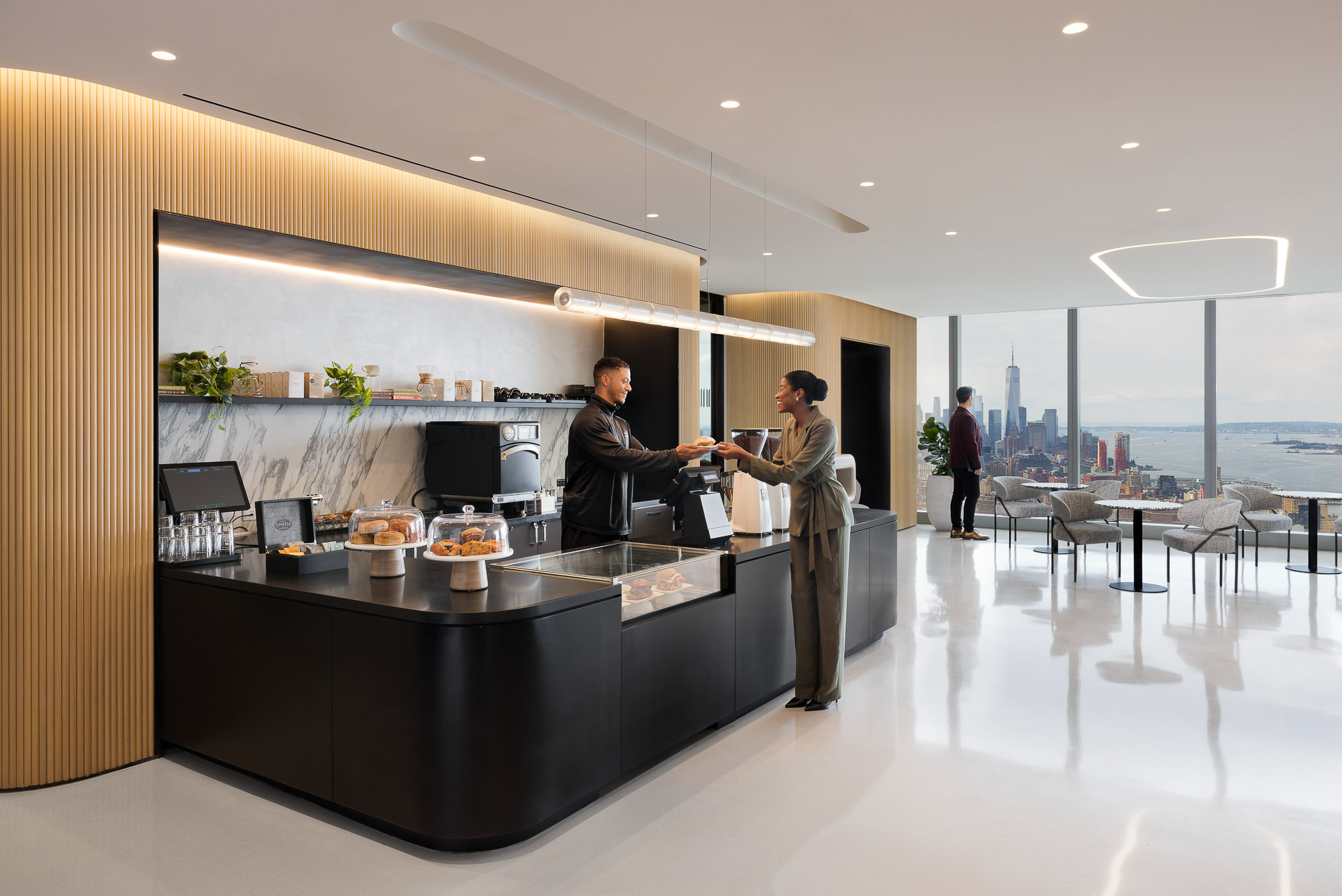 A couple of men in a kitchen.