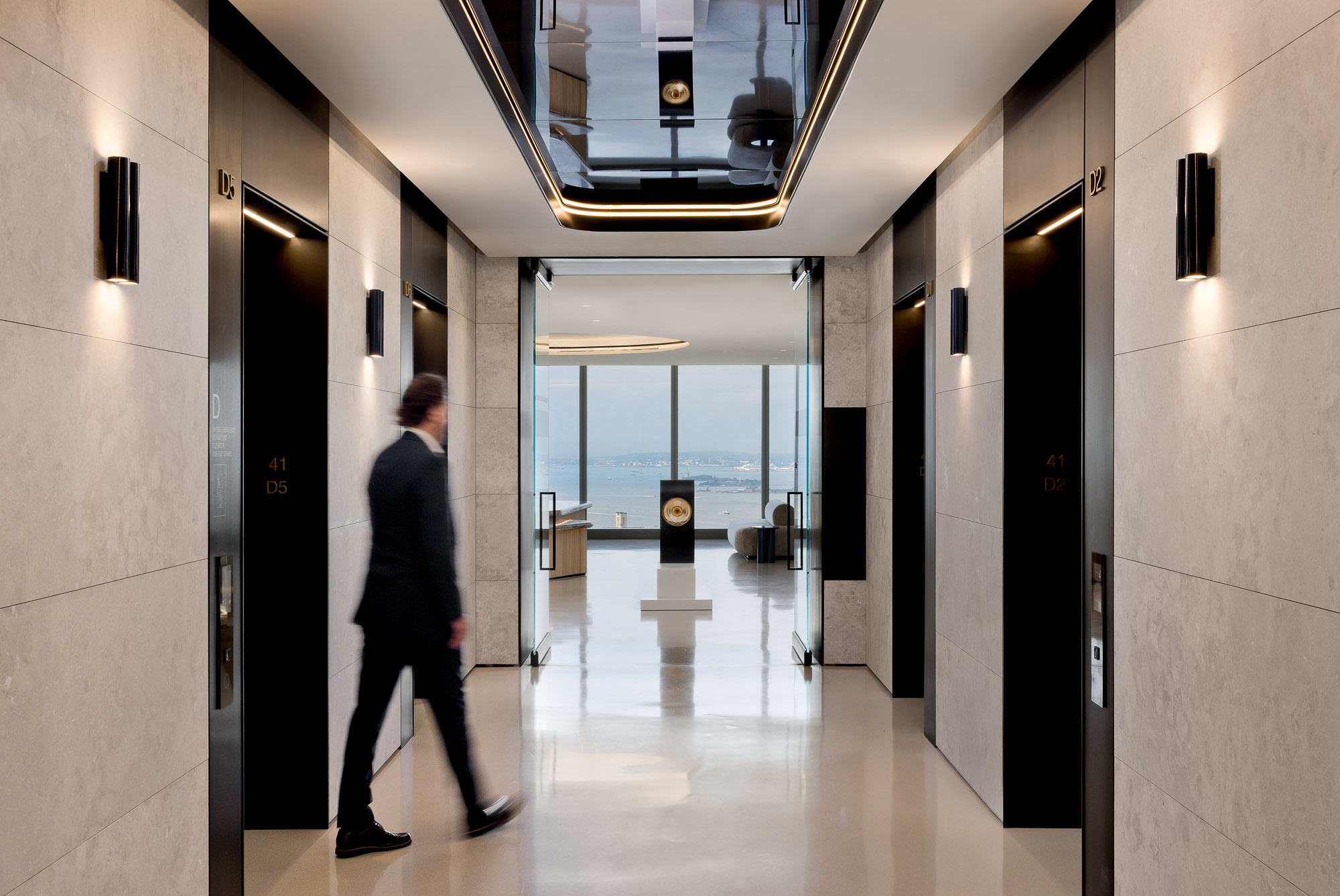 A person walking through a hallway.