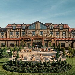 A building with a garden in front of it.