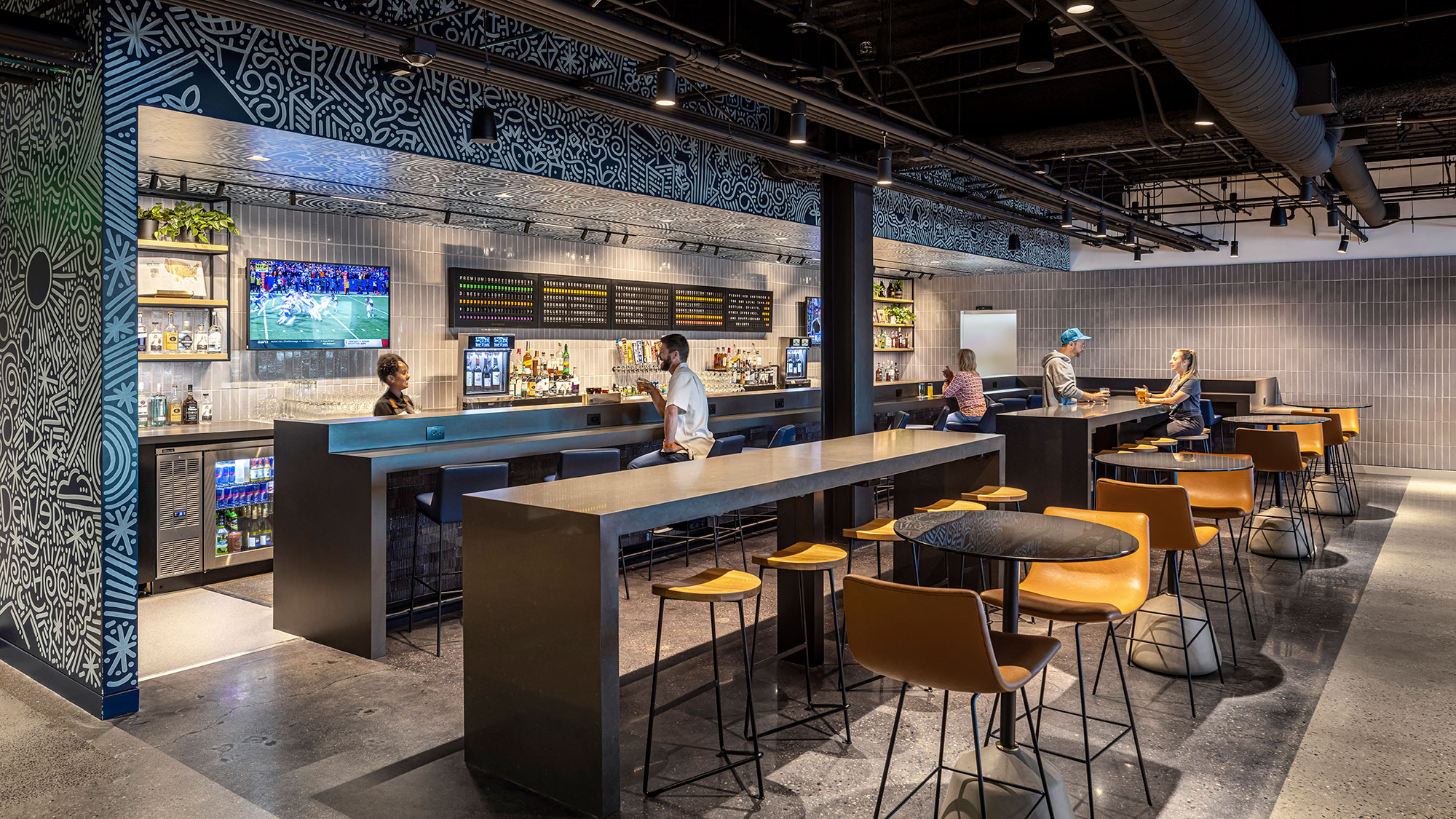 A group of people in a bar.