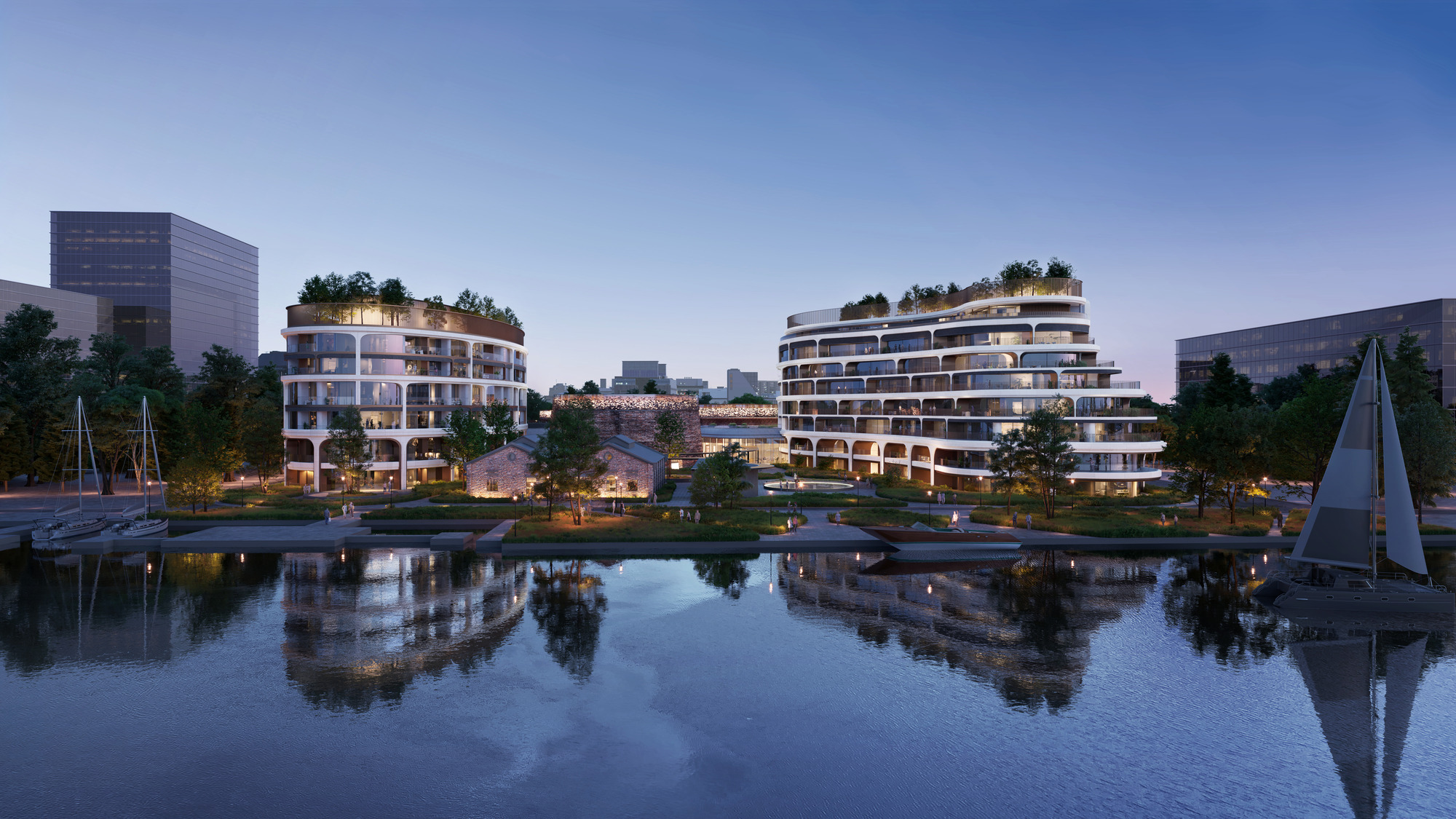 A body of water with buildings and trees around it.