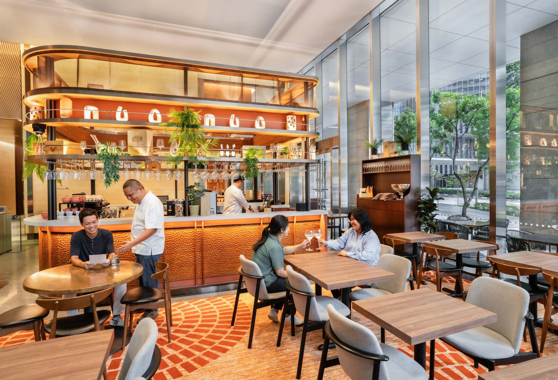 People sitting at tables in a restaurant.