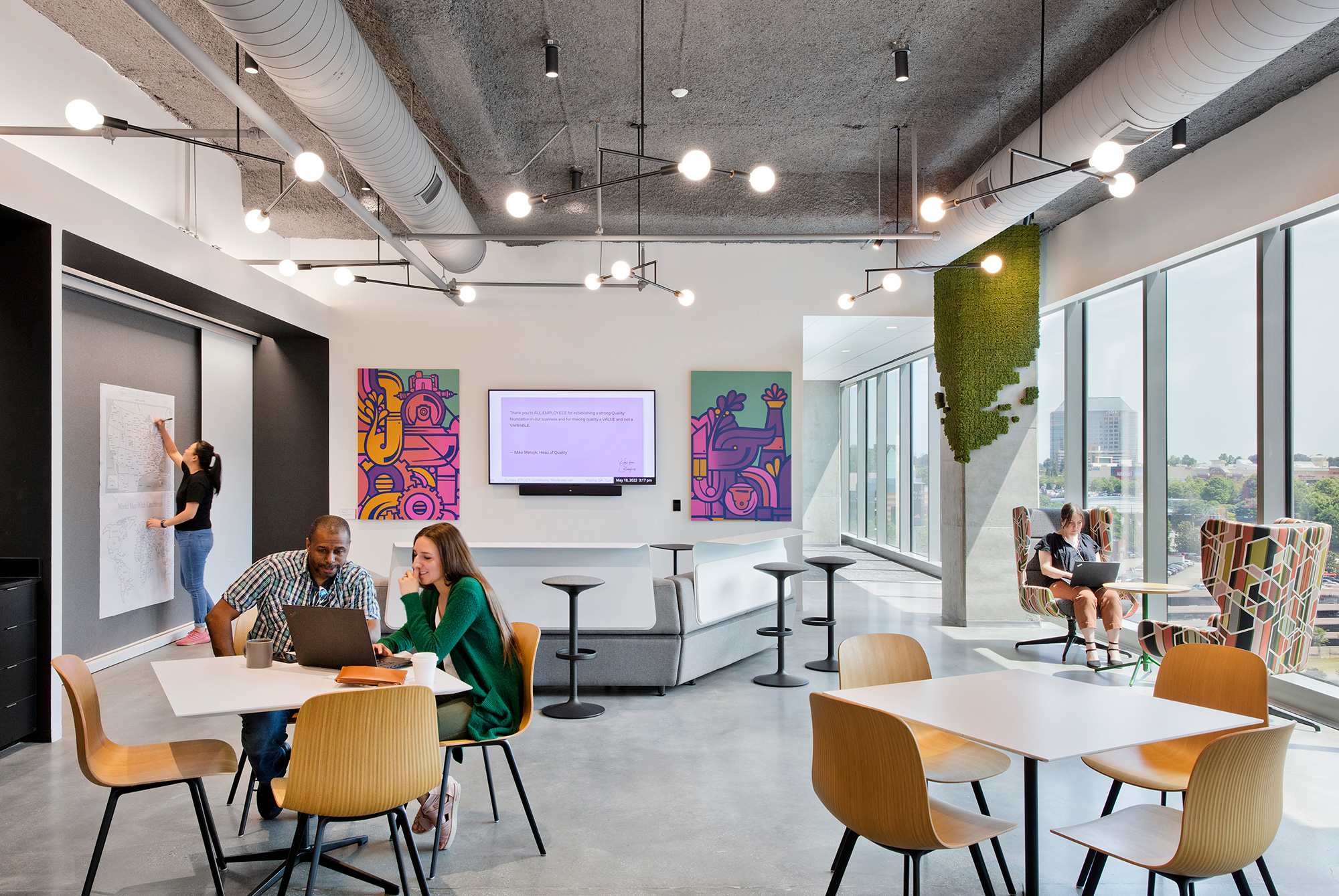 People sitting at tables in a room.