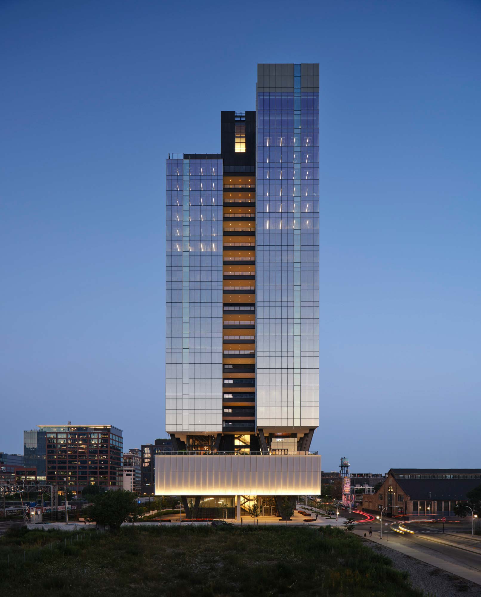 A tall building with a glass front.