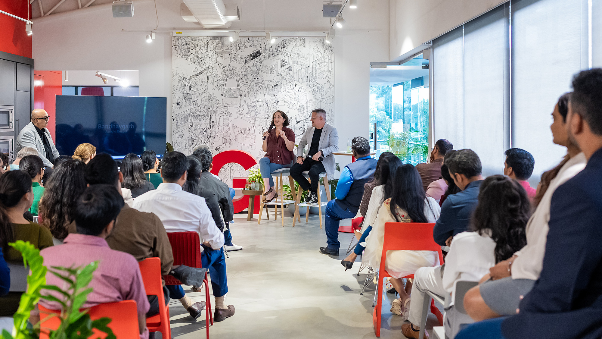 A group of people sitting in chairs.