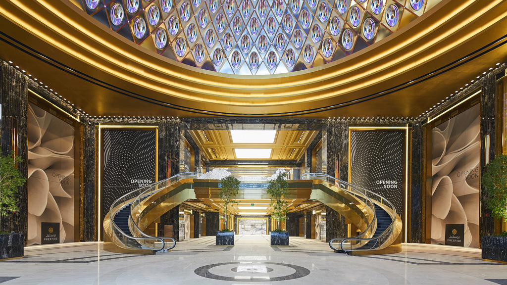 A large ornate building with a fountain.