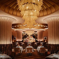 A room with tables and chairs.