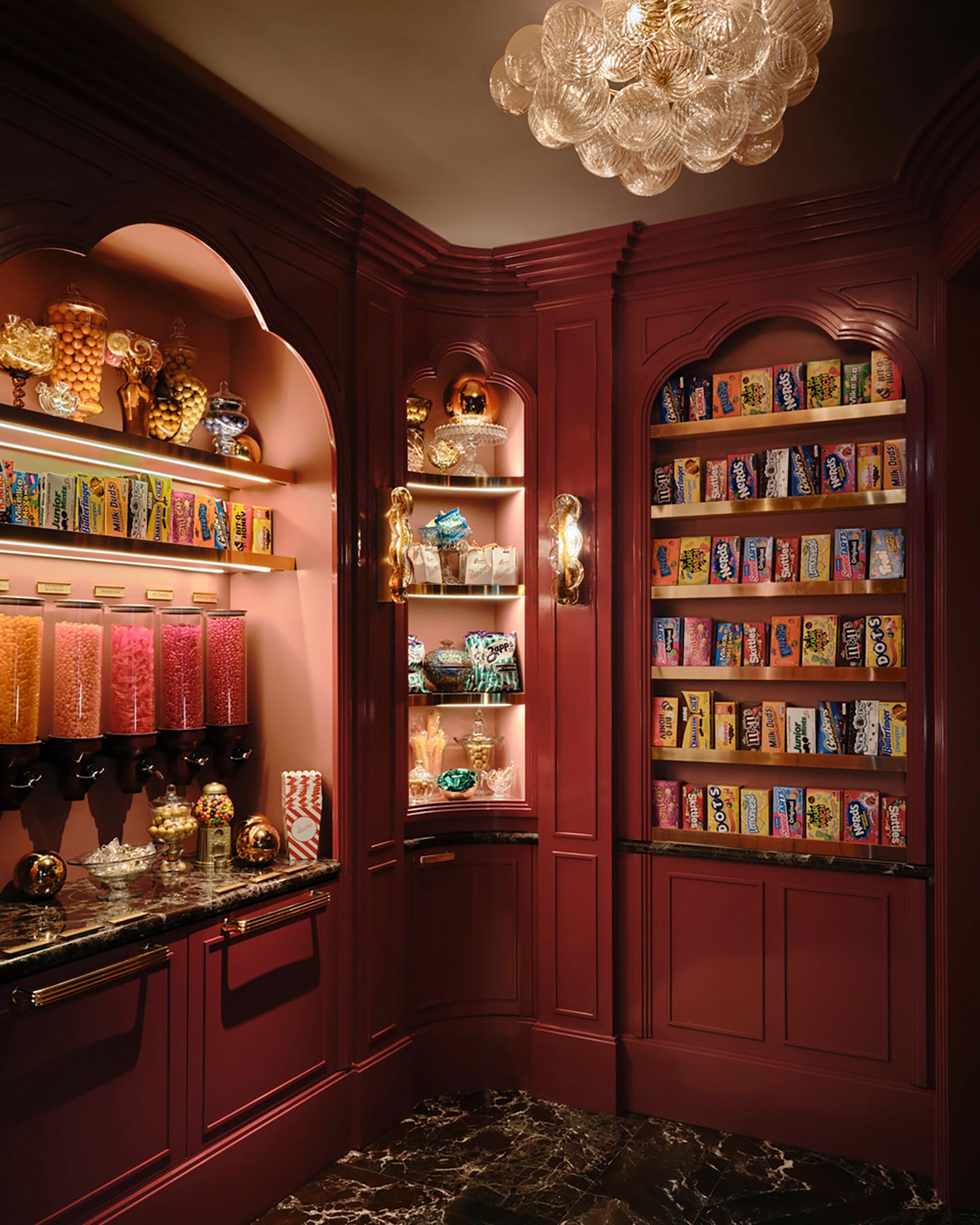 A kitchen with shelves and books.