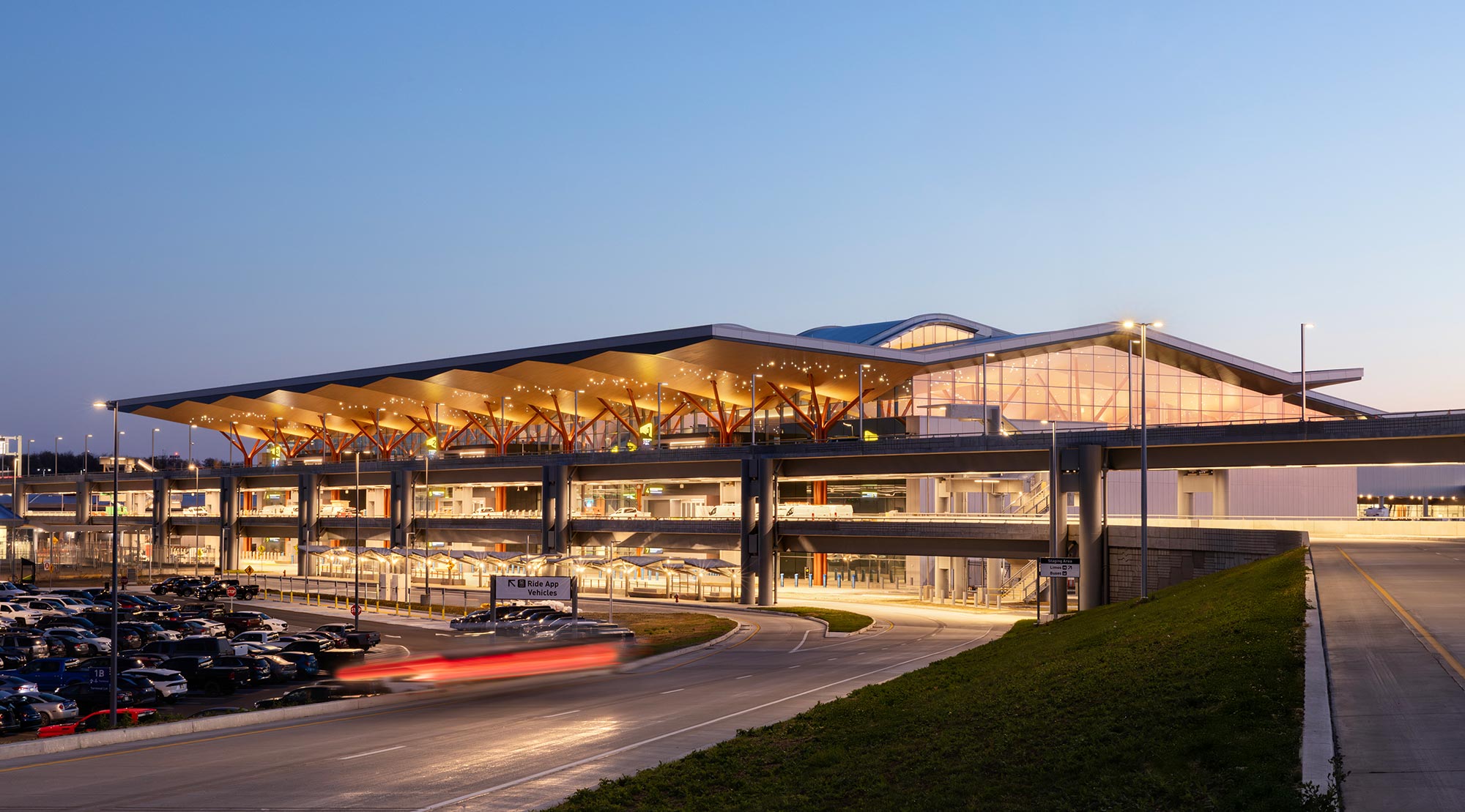 A building with a field in front.