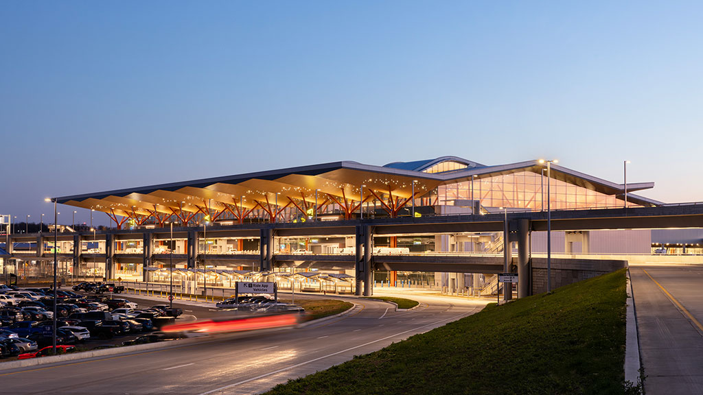 A large building with a parking lot.