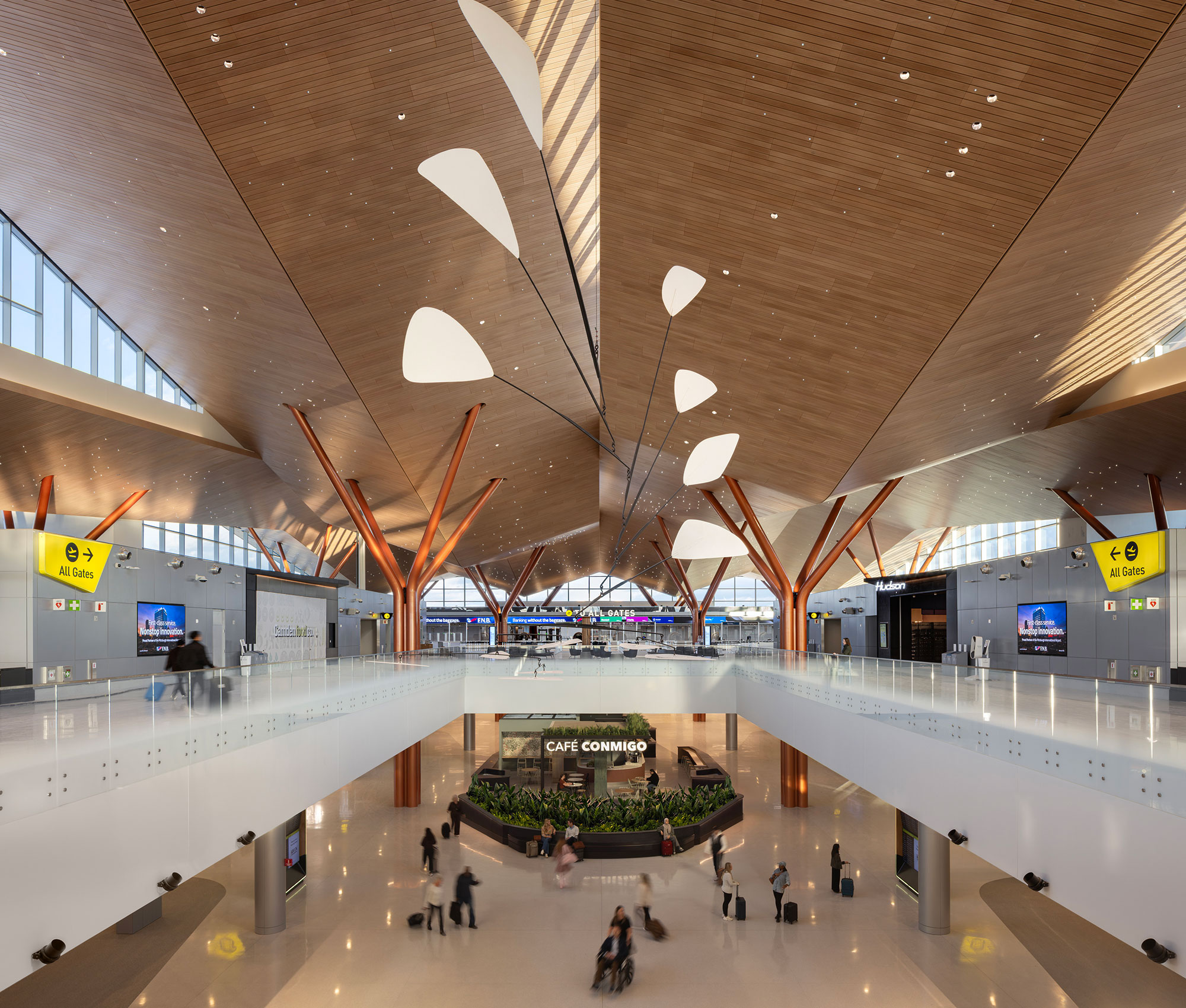 A large room with people and signs.