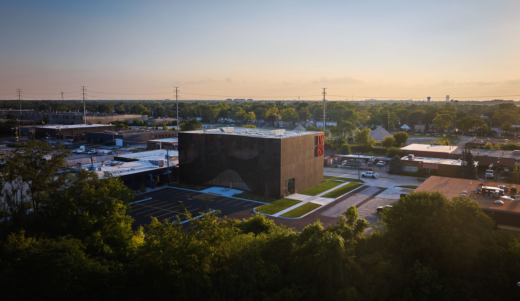 A large building with a parking lot.