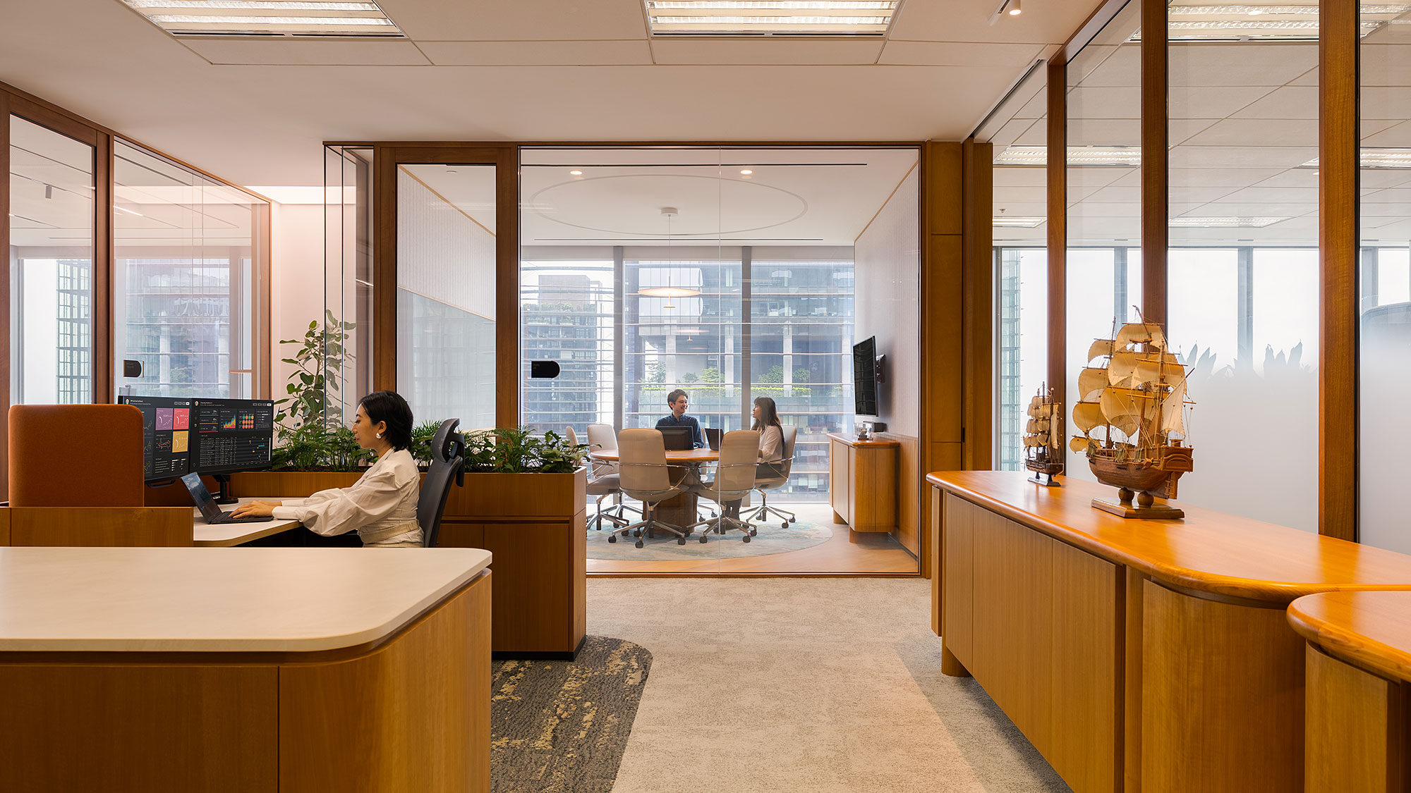 A person sitting at a desk in an office.