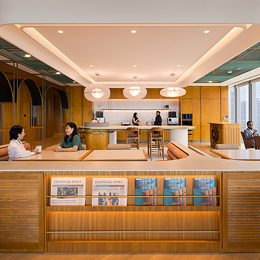 A few people in a office pantry.