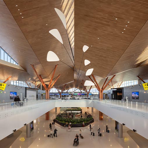 A large room with people and a large ceiling.