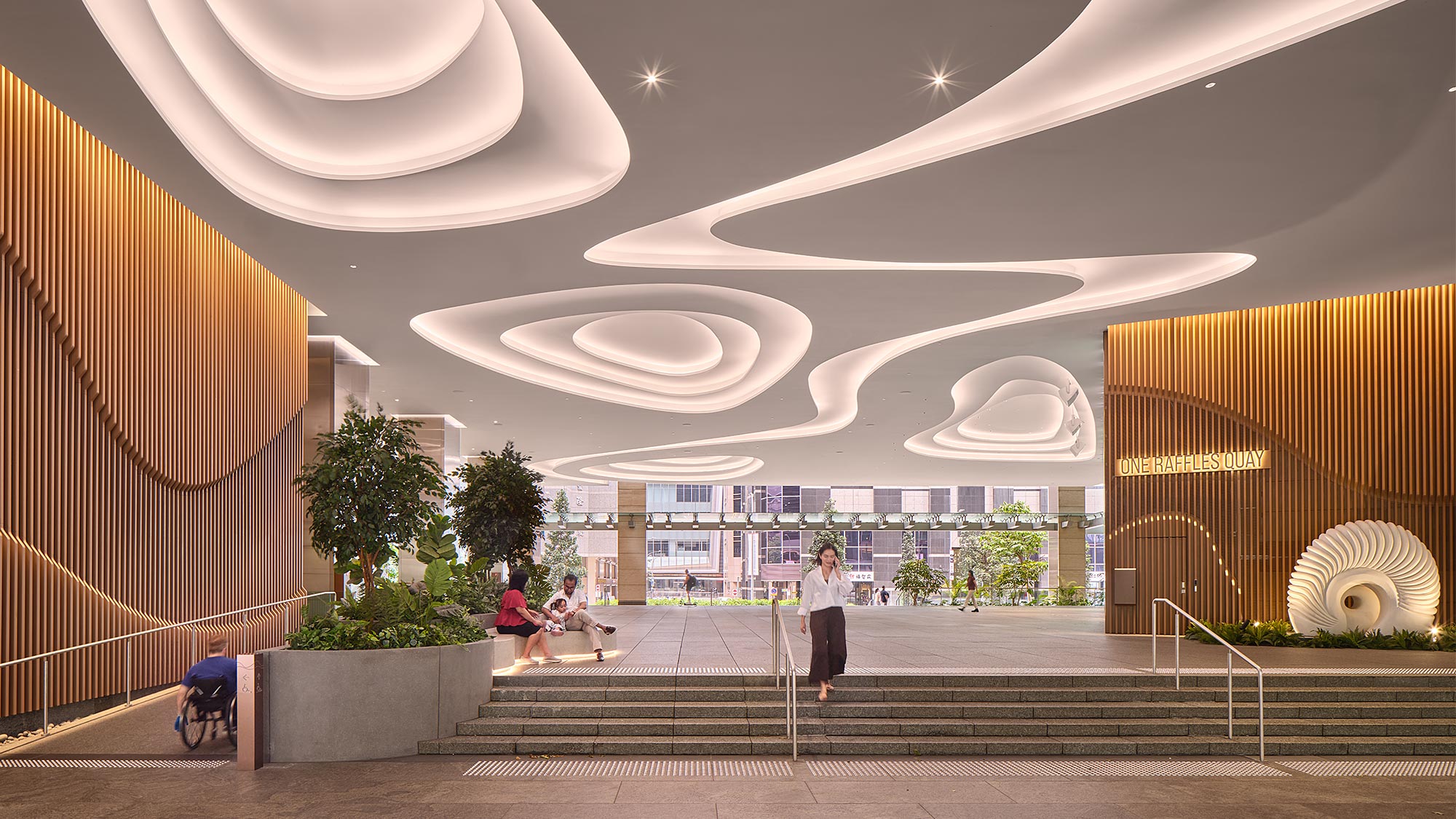 A group of people sitting on stairs.