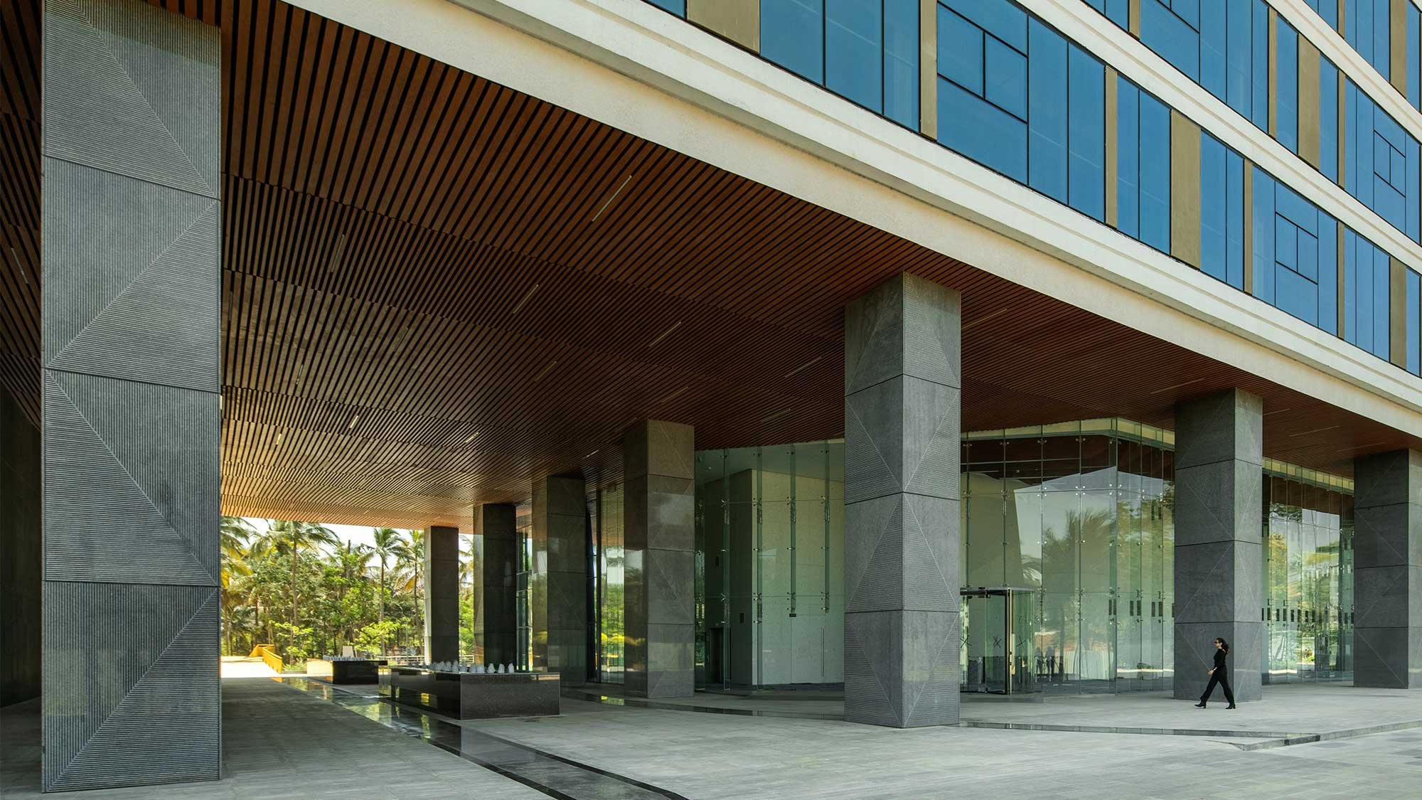 A person walking outside of a building.