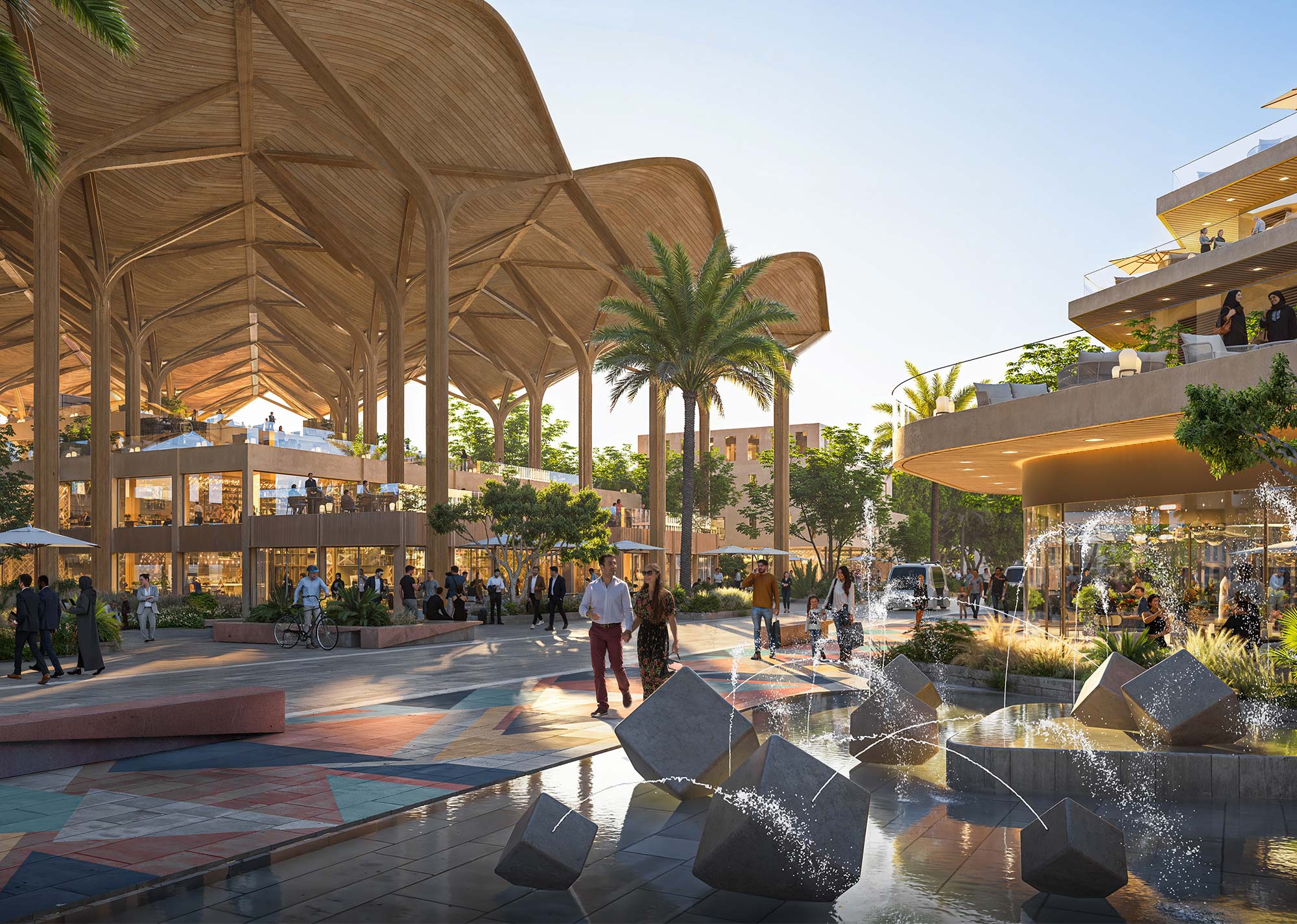 A group of people walking around a building with a large courtyard.