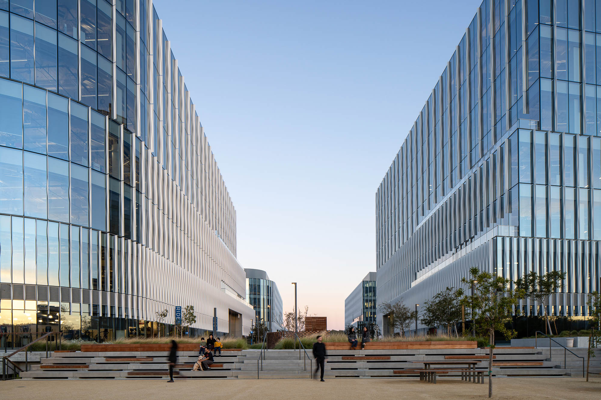 A group of people walking around a city.