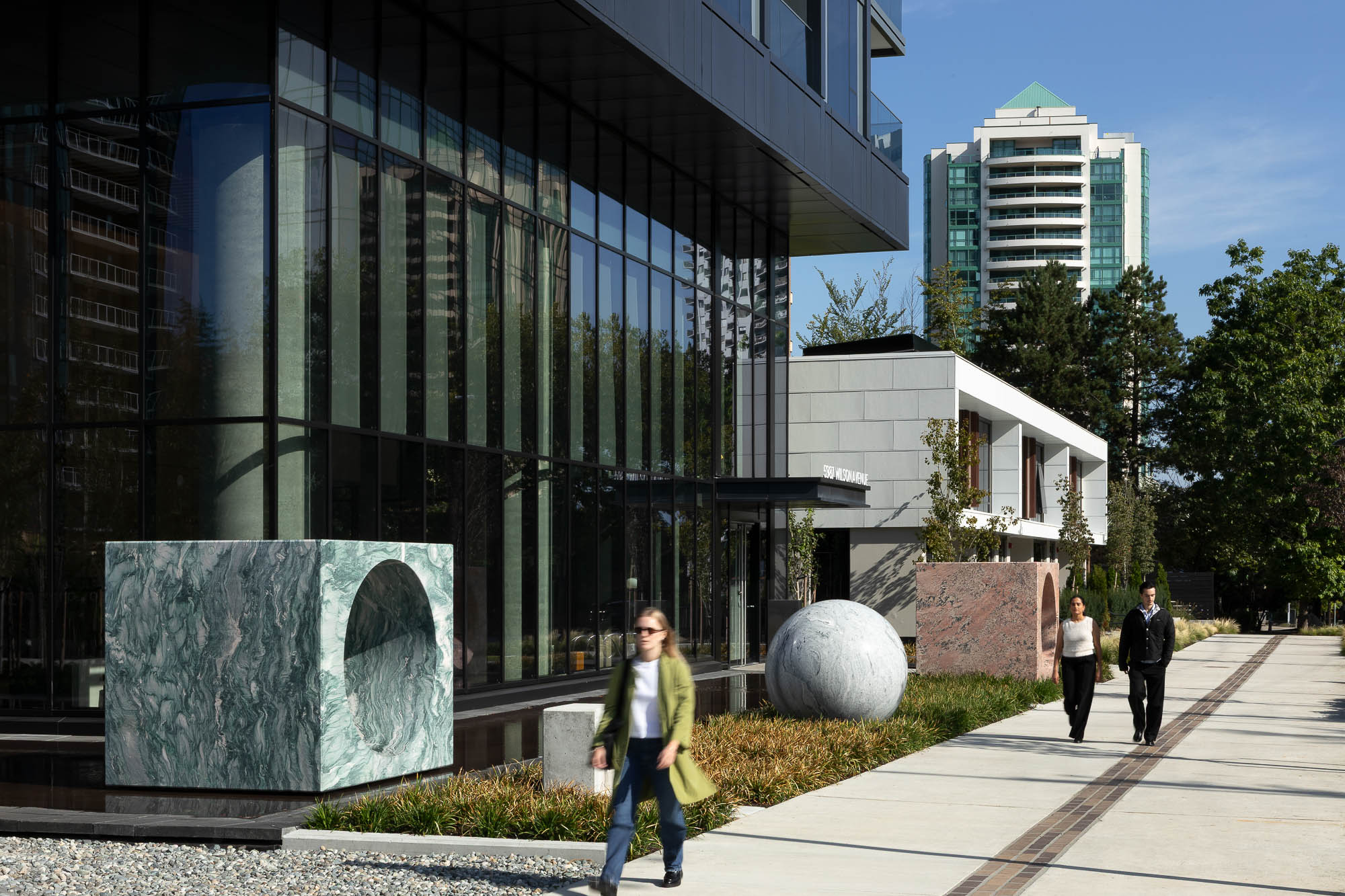 A person walking outside of a building.