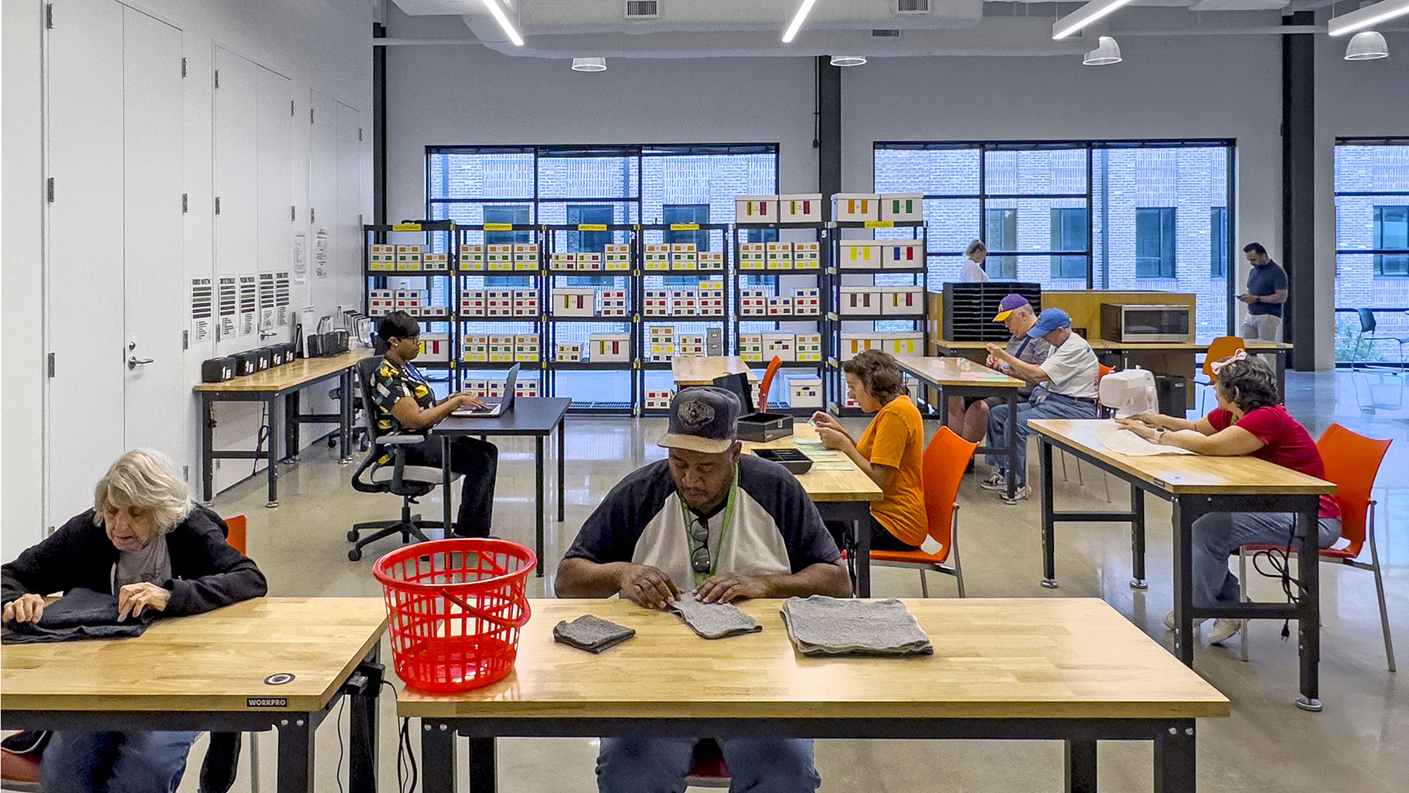 A group of people sitting at tables.