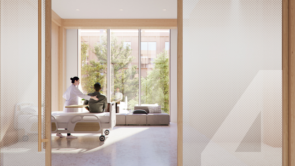 A man and woman sitting in a room with a large window.