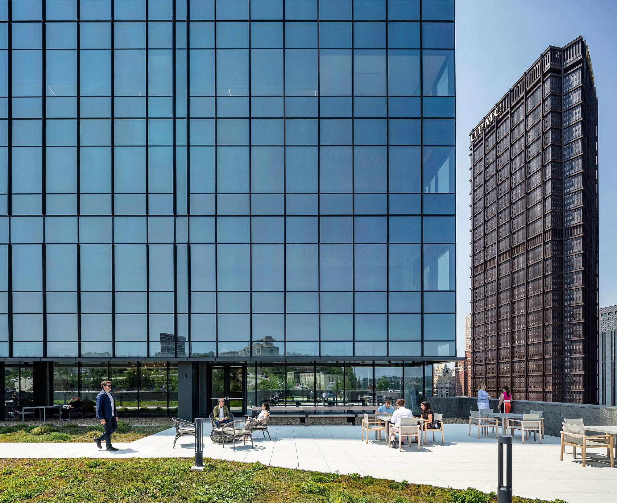 A group of people sitting outside of a building.