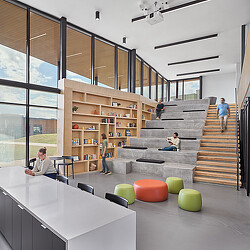 A group of people sitting on stairs.