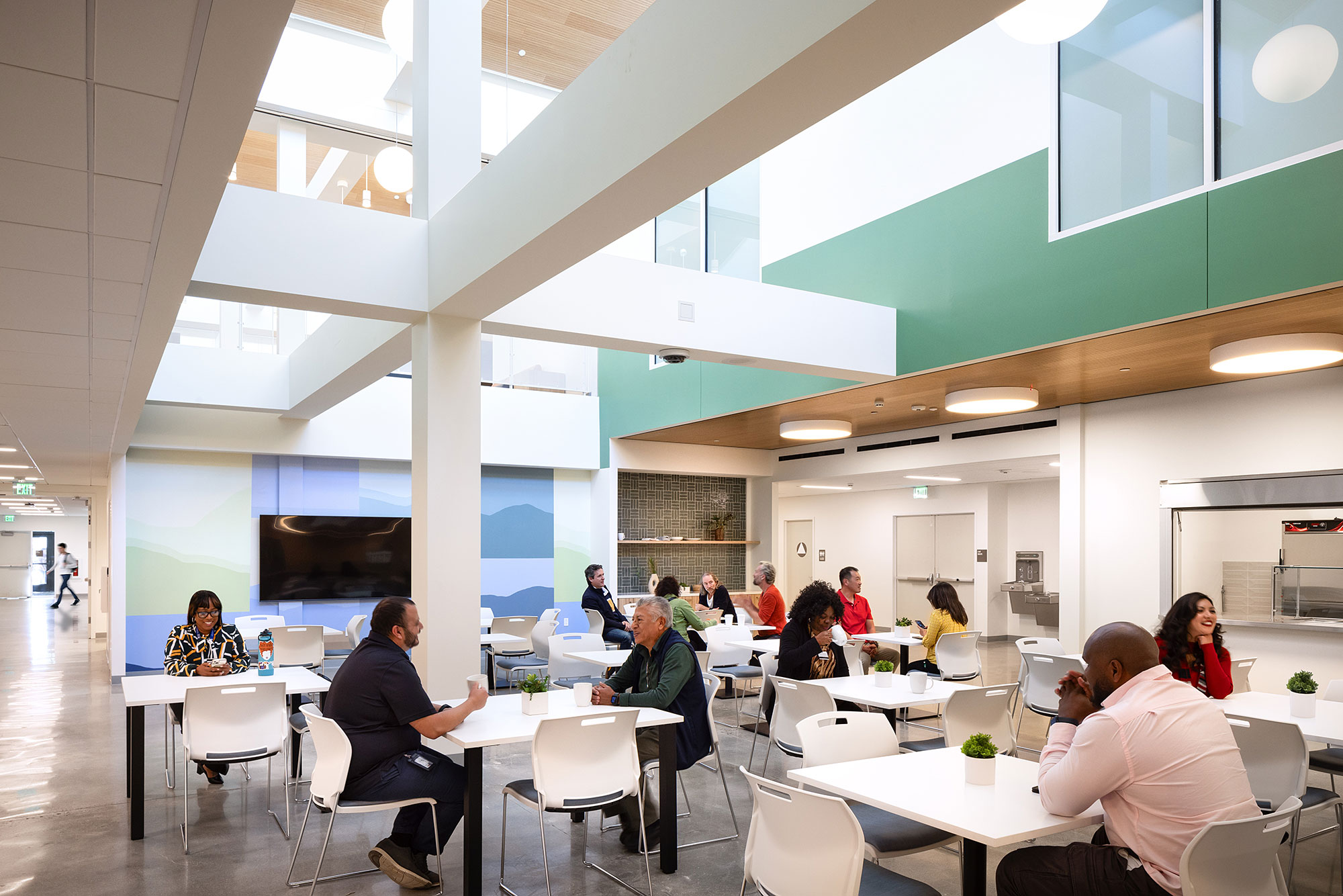 A group of people sitting at tables.