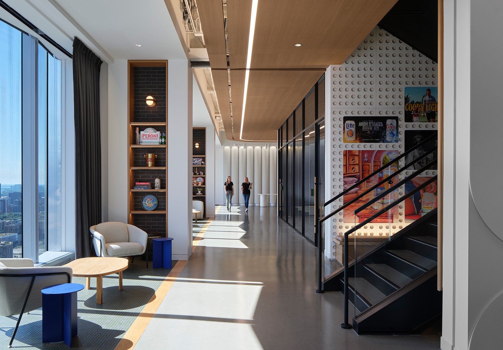 A room with a staircase and chairs.