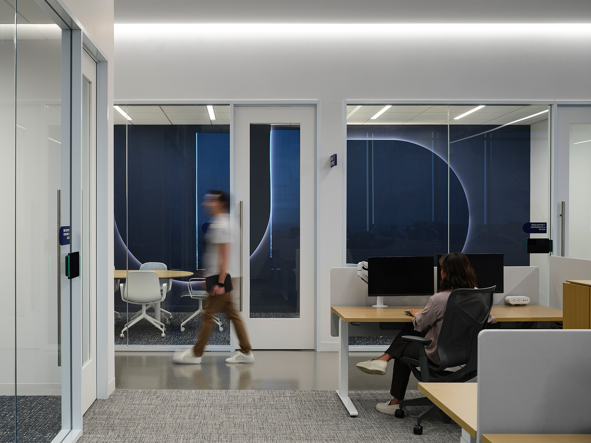 A man and a woman in an office.