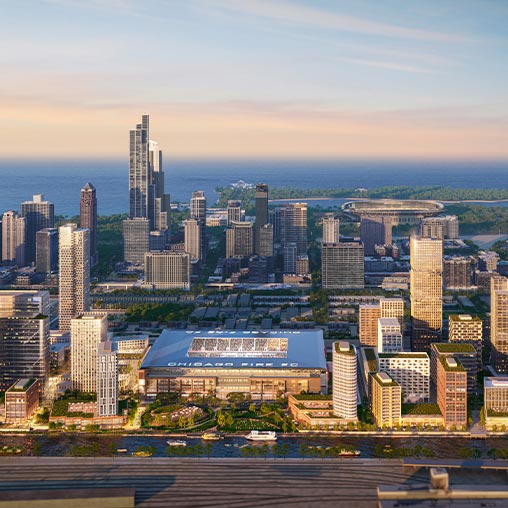 A city with a body of water in the background.