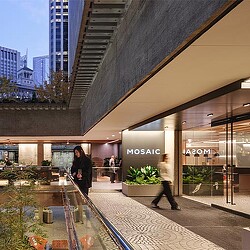 A group of people walking in a mall.