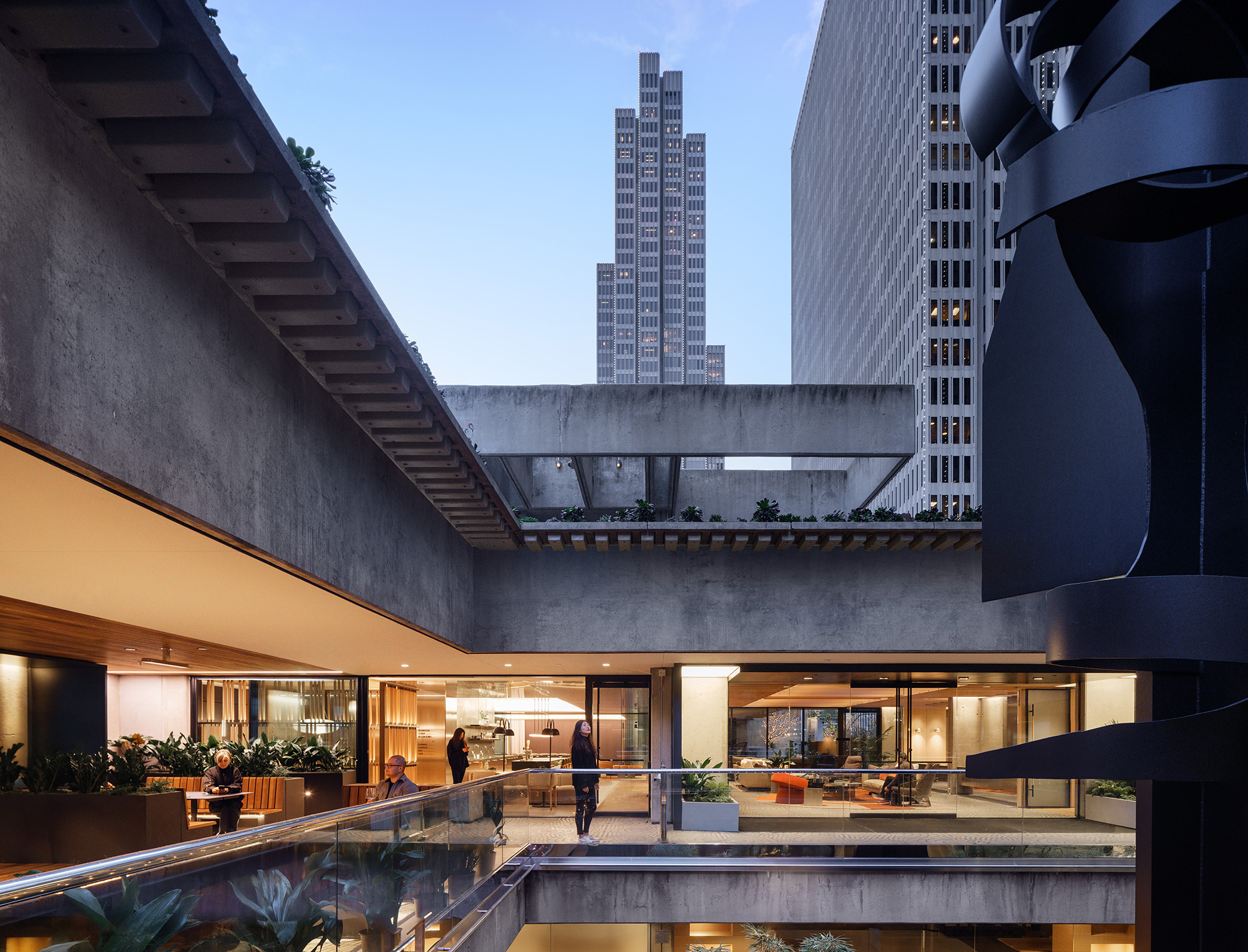 A building with a pool and a large glass wall.